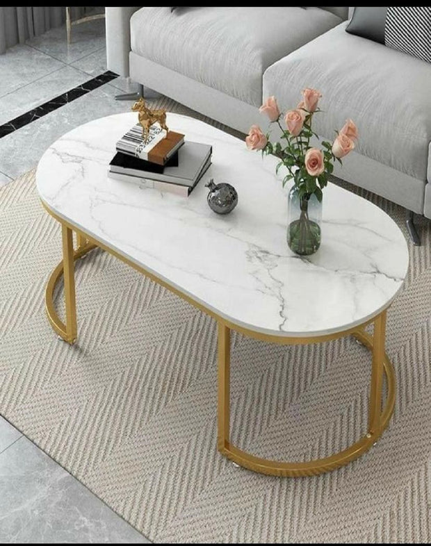 CAPSULE SHAPE COFFEE TABLE WITH GOLDEN FINISH