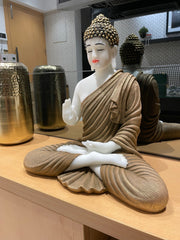 Skillfully handcrafted white and golden Gautam Buddha idol