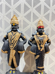 Competently handcrafted black and golden god Vitthal Rukmini idol