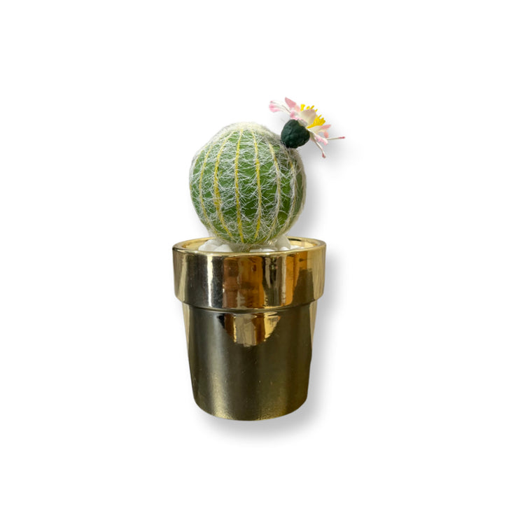 GOLDEN CERAMIC PLANTER WITH ARTIFICIAL LEAVES