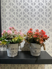 WHITE METAL PLANTER WITH ARTIFICIAL FLOWERS AND LEAVES